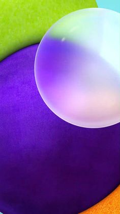 an image of a cell phone with soap bubbles on the screen and colorful circles around it