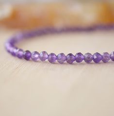 Wrap yourself in sparkle with this faceted Amethyst bracelet! Amethyst, the purple variety of Quartz, is said to encourage selflessness and spiritual wisdom, while improving motivation. It is a meditative gem that aids in providing a sense of calm, balance, and peace--who wouldn't want to tap into that goodness? Our bracelet is handmade in sterling silver or 14k gold filled with natural, micro-faceted Amethyst for extra sparkle! GEMSTONE: Natural Purple Amethyst STONE SIZE: 3mm (.1") SIZING: Ple Amethyst Faceted Beads Bracelet As Gift, Amethyst Faceted Beaded Bracelets For Gifts, Faceted Amethyst Beaded Bracelets As A Gift, Amethyst Faceted Beads Bracelet For Gift, Purple Faceted Beaded Bracelets As Gift, Faceted Purple Beaded Bracelets, Purple Faceted Beads Crystal Bracelet Gift, Faceted Purple Beaded Bracelets As Gift, Amethyst Bracelets With Faceted Round Beads