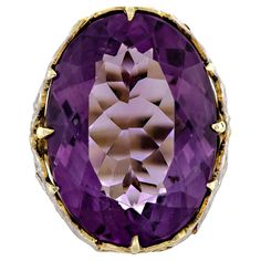 Exquisite antique amethyst and two-colored gold ring - centrally set with one large oval-shaped brilliant-cut rich deep colored purple amethyst measuring approximately 23.1mm x 18mm set into a lovely two-colored gold yellow and white - 14kt frame - elaborate foliate design. Ring Size: 6.5 Measurements: Amethyst: Approximately 23.1mm Length x 18mm Width Condition: Very Good Period: Circa 1890 Style: Victorian Amethyst Gold, Amethyst Jewelry, Deep Colors, 14kt Gold, Gold Yellow, Purple Amethyst, Cocktail Rings, Kitsch, Gold Ring