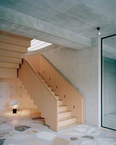 an empty room with stairs leading up to the second floor