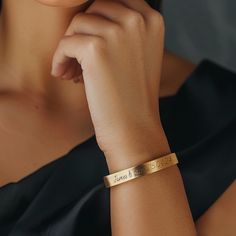 This custom handwritten bracelet is a beautiful combination of personalization and elegance. Crafted from 14k gold, this open cuff bracelet features a delicate 7mm width, making it perfect for everyday wear. Designed as a unisex bracelet, it suits both men and women, and its adjustable feature ensures a comfortable fit for any wrist size. The bracelet's unique custom handwritten message adds a personal touch, making it an ideal gift for her. Whether it's a name, date, or special message, this bracelet allows you to carry a cherished memory with you. Handmade with precision, this gold bracelet exemplifies fine craftsmanship and thoughtful design, making it a standout piece in any jewelry collection. 📏 Wrist Size: Kindly provide your wrist size in the designated text box or the drop-down me Elegant Gold Name Bracelet With Custom Text, Rose Gold Engraved Bangle For Wedding, Classic Rose Gold Name Bracelet For Wedding, Personalized Cuff Bracelet As Gift, Engraved Bangle Cuff Bracelet For Wedding, Elegant Name Cuff Bracelet As Gift, Elegant Engraved Cuff Bracelet For Personalized Gift, Elegant Engraved Cuff Bracelet As Personalized Gift, Gold Hand Stamped Wedding Bracelets