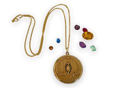 "Description: A large and lovely antique round Art Deco era monogrammed gold filled photo locket on a new 14K gold filled chain.  The front of this locket made by the SB Company, features a central raised oval shape surrounded by a total of 14 \"paste\" stones. The stones that were probably once clear have darkened with age. There are 7 in paste gems on each side of the central oval. At the top and at the bottom of this oval shape is a raised fleur de lis. There are a total of 6 raised vertical Antique Locket, Round Art, Photo Locket, Antique Art Deco, Art Deco Era, Tiny Flowers, Locket Necklace, Gold Filled Chain, Cut Glass