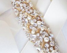 Bridal belt sash Bridal Swarovski crystal belt sash Wedding | Etsy Elegant Bedazzled Wedding Sash, Elegant Bedazzled Bridal Belt For Wedding, Elegant Gold Bridal Belt For Reception, Elegant Embellished Bridal Belt For Wedding, Glamorous Wedding Bridal Belt With Crystals, Glamorous White Bridal Belt For Wedding, Elegant Embellished Sashes, Glamorous Embellished Bridal Belt For Wedding, Elegant Pearl Embellished Sashes For Party