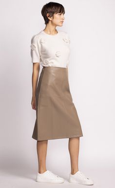 The Peyton Skirt is a chic mid-length faux leather piece that adds a touch of sophistication to any outfit. Style it with a tucked-in blouse and heels for a polished look! Material: 55% PU, 45% Polyester Tapered panel detail Back zip closure Model is wearing XS Vegan Leather Skirt, Pink Martini, Swimsuit With Shorts, Leather Skirts, Thick Heel, Swimsuit Dress, Leather Pieces, Dress Gift, Outfit Style