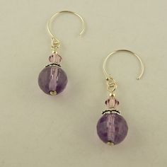 Made in the USA East of Eden Chakra Intuition Sterling Silver Hoop earrings w/ 8mm faceted round Amethyst & 4mm genuine Swarovski light amethyst crystal beads Sterling silver hoop Sterling silver bead caps Closed my brick and mortar store. My loss is your gain. Check my other auctions and listings for more Celtic and Irish jewelry. Listing lots of beads and findings as well so you can create your own jewelry. Check out my other items! Insured USPS shipping in a padded envelope with tracking number On Jan-15-16 at 12:44:04 PST, seller added the following information: Track Page Views With Auctiva's FREE Counter Hypoallergenic Purple Round Bead Earrings, Lavender Amethyst Round Earrings, Sterling Silver Round Bead Crystal Earrings, Adjustable Sterling Silver Beaded Crystal Earrings, Amethyst Faceted Beads Jewelry, Round Faceted Amethyst Beads Jewelry, Nickel-free Round Purple Earrings, Lavender Jewelry With Faceted Beads, Lavender Round Jewelry With Faceted Beads