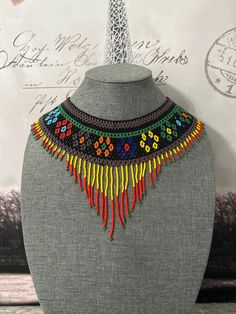 Beautiful artisanal necklace handmade by Mexican artisans. Artisan Beaded Adjustable Bib Necklace, Artisan Beaded Bib Necklace With Adjustable Fit, Handmade Bohemian Choker Necklace, Artisan Beaded Chain Necklace, Artisan Fair Trade Necklaces With Round Beads, Artisan Beaded Pendant Necklace, Bohemian Handmade Pendant Bib Necklace, Traditional Handmade Pendant Choker, Handmade Bohemian Pendant Bib Necklace