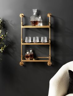 a shelf with glasses and bottles on it