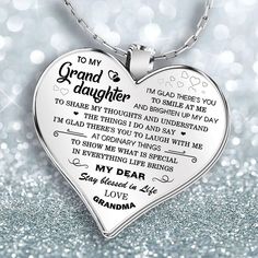 a heart shaped necklace with the words to my grand daughter on it's side