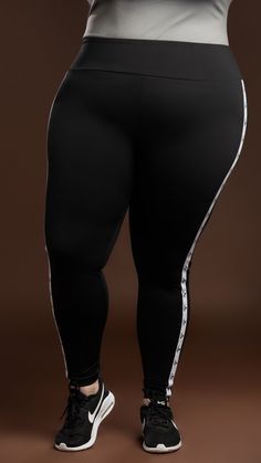 Take your active wear to the next level with this legging. Perfect for an active day at the gym or running errands around the city. This legging comes in a luxurious Nylon/Spandex material that is perfect for smoothing and holding everything in place. Style it up with our V-Neck Top (Black) Model is wearing a size 18/20 75% Nylon/25% Spandex Fits true to size TMC logo on on each side of the leggings Color may vary due to lighting on images Compressive Athleisure Bottoms For Streetwear, High Stretch Leggings For Streetwear Athleisure, Black Elastane Leggings For Streetwear, High Stretch Leggings For Streetwear In Athleisure Style, Sporty Stretch Leggings For Jogging, Black Streetwear Leggings, High Stretch Athleisure Leggings For Streetwear, Compressive Athleisure Leggings For Jogging, Stretch Athleisure Leggings For Jogging