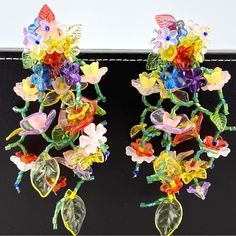 Add Some Playful And Colorful Flair To Your Outfit With These Beaded Flower Waterfall Statement Earrings! The Colorful Beaded Flowers Create A Fun And Eye-Catching Dangle Statement That Will Surely Make A Statement. (Warning: May Cause Compliments To Rain Down On You!) Elegant Multicolor Beaded Flower Earrings, Multicolor Beaded Flower Earrings For Spring, Spring Multicolor Beaded Flower Earrings, Bohemian Multicolor Handmade Flower Earrings, Multicolor 3d Flower Earrings, Multicolor Beaded Flower Earrings With Flower Charm, Multicolor Flower Shaped Beaded Earrings With Flower Charm, Multicolor Beaded Flower Earrings, Multicolor Flower-shaped Beaded Earrings With Flower Charm