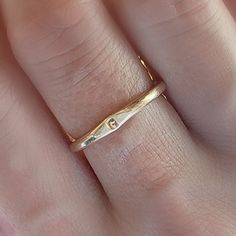 Adorn you hands with this timeless Minimal Initial Signet Ring. Hand-crafted from 14K yellow gold filled, this ultra-chic ring is a perfect gift for moms or couples. It's a unique, minimal piece with the power to carry a special, sentimental message. Rings are handmade in our Indiana studio. There will be a small color difference in the gold where it is soldered together in our studio. Please add initial in the NOTES box at checkout. Minimalist Stackable Initial Ring For Anniversary, Adjustable Yellow Gold Initial Ring, Simple Gold Stackable Initial Ring, Simple Gold Engraved Promise Ring, Simple Gold Engraved Ring For Anniversary, Gold Minimalist Stackable Engraved Ring, Minimalist Gold Engraved Stackable Ring, Simple Gold Initial Ring For Anniversary, Simple 14k Gold Engraved Ring For Anniversary