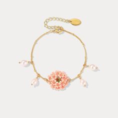 This Pink Verbena Bracelet crafted from exquisite Selenichast is an elegant accessory to enhance any look. With its timeless design and subtle shimmer, it makes for a beautiful statement piece that exudes luxury. Detail Plating: 18K Gold Materials: 18K Gold on Brass, Enamel, Freshwater Pearl Size: Length:6.1"(15.5cm)+Extender: 1.77"(4.5cm) Weight: 8.6g Hypoallergenic design Elegant Gold Beaded Bracelet With Flower Charm, Elegant Rose Gold Bracelets With Flower Charm, Elegant Rose Gold Bracelet With Flower Charm, Elegant Pink Chain Bracelet With Adjustable Chain, Delicate Floral Bracelet For Formal Occasions, Delicate Yellow Gold Flower Bracelet, Elegant Bracelets With Flower Charm As Gift, Elegant Bracelets With Flower Charm For Gift, Elegant Bracelet With Flower Charm For Gift