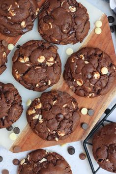 chocolate cookies and white chocolate chips on a cutting board