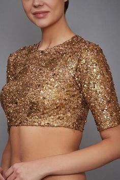 Gold blouse with all-over metallic sequin work.
Component: 1
Embroidered
Neckine: Round
Sleeve Length: Half
Fabric: Viscose
Color: Gold
Back keyhole
Closure: Side zip
 - Aza Fashions Sequin Blouse Designs Latest, Gold Blouse Designs Latest, Embellished Saree Blouse, Sequin Blouse Designs, Golden Blouse Designs, Gold Blouse Designs, Gold Saree Blouse, Embellished Saree, Golden Blouse