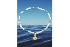 This unique and stylish necklace is perfect for any bohemian or beach surfer. The Heishi Evil Eye Beaded Necklace features a stunning spiral pendant in 18K gold plated mixed brass, giving it an elegant touch. The necklace itself is made with disc polymer beads in a beautiful turquoise color, along with Czech beads and 24K gold plated beads for a touch of luxury. The pendant has a diameter of 27 mm by 13 mm, while the necklace has a length of 45 cm. Not only is this necklace fashionable, but it i Spiral Pendant, Polymer Beads, Surfer Style, Surfer Necklace, Stylish Necklace, Boho Gifts, Czech Beads, Gold Plated Jewelry, Bead Necklace