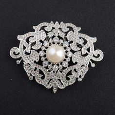 *Victorian American Diamond & Fresh Natural Pearl Handmade Brooch, 925 Sterling Silver Purity Brooch, Wedding/Engagement Brooch **Product Details :-- *Gemstone :-- American Diamond (CZ) & Fresh Pearl *Gemstone Weight :-- 6.80ct Zircon & 4.25ct Pearl *Metal -- 925 Sterling Silver *Silver Wt. -- 25-30gm *Finishing : Platinum Plated Over 925 Silver *This is very Beautiful & Pretty Brooch. Everyone Can be gifted it For His/Her Mother and Daughter. ▶ Want to find out more? Check out my shop https://w Luxury Silver Engagement Brooches, Wedding Sterling Silver Brooch With Intricate Design, Victorian Silver Wedding Brooches, Victorian Silver Brooches For Gifts, Victorian Hallmarked Diamond Brooches, Brooch Wedding, Antique Brooches, Brown Diamond, Natural Pearl