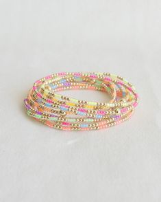 ❖MADI❖ ‣ This listing is for a single bracelet. ‣Madi bracelet features: * 2mm Seed Beads * 2mm 14k Gold Filled Beads * 1-4m 14k Gold Filled Bead Julisa Bracelets Feature:  ‣ Tight/Sturdy elastic, pre-stretched to prevent bracelet from stretching out ‣ Sizing according to wrist size ‣Sizing Tips:  Please measure your wrist for the best fit!  *Using a soft tape measure/string, measure around your wrist, above the wrist bone *Add length according to your desired fit:       * 0" - fitted, snug      * .25" - slight movement      * .5" -  relaxed      * .75"- loose      * 1" - extra loose *Please message us if you need any help with sizing!  ------- ‣Each bracelet is made to order ‣We hand-bead each and every bracelet, please allow for slight variations ‣Your order will ship in a custom jewelry Neon Beaded Bracelet, Bead Bracelet Ideas Color Combinations, Gold Bracelet Stacks, Bead Bracelets Words Ideas, Stretch Beaded Bracelets Diy, Beachy Bracelets, Diy Friendship Bracelets Tutorial