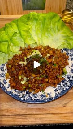 lettuce leaves with meat and vegetables on a plate