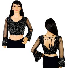 Item Description Beautiful Women's Velvet Sequins V-Neck Net Sleeves Ethnic Designer Blouse Fabric:-Velvet Sequins Color:-Black Sale For:-1 Blouse Closure Type:-Back Hook & Eye With Dori Sleeves Type:-3/4 Sleeves Neck Style:-V-Neck Product:-Padded Blouse With Cotton Inner Lining Care Instructions:-Hand Wash or Dry Clean Only Disclaimer:-The Actual Color Of The Product Slightly Vary From The Image Due To Photographic Light Or Monitor's Display. Measurement Sleeves Length:-21.5 Inch Front Neck Depth :-8 Inch Back Neck Depth :-11.5 Inch Ethnic Sequins Work Velvet Designer Blouse Net Sleeves To Give Yourself A Splendid Traditional Makeover! A Perfect Match For Your Grand Sarees.Pair This Ready To Wear Blouse With Any Type Of Saree In Various Occasions.This Would Be Classy Yet Fashionable Choic Fitted V-neck Anarkali Sets, Festive V-neck Sequin Sets, Festive V-neck Georgette Blouse Piece, Traditional V-neck Sharara For Party, Festive Georgette V-neck Blouse Piece, Party V-neck Georgette Saree, Fitted V-neck Top With Mirror Work, Sequined V-neck Sets For Party, Party Sets With Mirror Work And V-neck