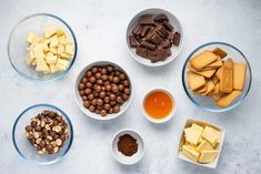 several bowls filled with different types of food