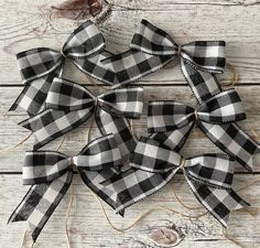 black and white buffalo plaid ribbon bows on wood planks with twine for decoration