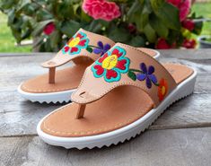 New womens flower embroidered leather slip on authentic mexican huarache sandals Leather Flat Sandals For Summer, Brown Leather Flip Flops For Spring, Summer Sandals With Rubber Sole And Flat Base, Bohemian Sandals With Leather Sole For Spring, Summer Leather Huarache Sandals With Cushioned Footbed, Spring Leather Flip Flops With Single Toe Strap, Leather Flip Flops With Single Toe Strap For Spring, Flat Sandals With Stitched Sole For Summer, Spring Rubber Sole Open Toe Flip Flops