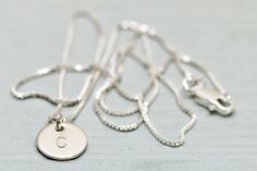 Sterling silver initial necklace - This minimalist necklace features a petite but thick sterling silver disc, hand stamped with your chosen initial and suspended from lovely sterling silver box chain. Arrives gift boxed in Sea and Cake packaging.*Length on model is 16 inches. *All components are sterling silver.*Available with 1-3 discs.*Sterling silver disc is 9mm and 20 gauge thick.*Handmade with love in the USA!*Initial(s) will be in uppercase block font.For more Sea and Cake: Pinterest - htt Cake Pinterest, Simple Silver Necklace, Sterling Silver Initial Necklace, Silver Initial Necklace, Initial Necklace Silver, Initial S, Silver Necklace Simple, Block Font, Cake Packaging