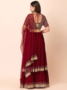 Introducing the "wonderful maroon sequins georgette party wear lehenga choli" - a stunning ethnic ensemble that showcases elegance and style. Crafted with meticulous attention to detail, this maroon lehenga choli is perfect for receptions, weddings, festivals, and parties, making it a must-have addition to your wardrobe.
This extraordinary lehenga choli is its exquisite design and superior craftsmanship. Made from high-quality georgette material, the maroon color of the lehenga enhances its rega Bollywood Style Choli With Sheer Dupatta For Party, Festive Pre-draped Georgette Saree For Celebrations, Chandbali Georgette Set For Diwali, Burgundy Anarkali Dupatta For Festivals, Semi-stitched Floor-length Pre-draped Saree For Celebration, Festive Celebration Pre-draped Georgette Saree, Festive Burgundy Dresses For Weddings, Festive Burgundy Dress For Wedding, Festive Burgundy Wedding Dress