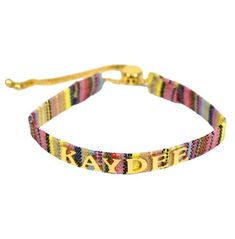 Kappa Delta Name Bracelet with adjustable drawstring clasp and group nickname in gold colored letters. Casual Adjustable Name Bracelet, Adjustable Letter Print Friendship Bracelets As Gifts, Trendy Adjustable Custom Name Jewelry, Trendy Adjustable Jewelry With Custom Name, Casual Gold Adjustable Friendship Bracelets, Casual Custom Name Friendship Bracelets, Casual Custom Name Jewelry For Friendship, Adjustable Gold Casual Friendship Bracelets, Casual Gold Friendship Bracelets