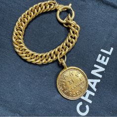 Vintage Chanel Bracelet From The Late 1970's - Early 1980's Collection 100% Authentic Made In France Gold Plated Excellent Condition Overall Aside From Light Wear And Scratches Throughout Metal Measurements Approx.: Inside Circumference: 8.5" Ornament-Length: 1.75" Ornament Width: 1.25" Comes With Box Vintage Gold Bracelet With Logo Charm, Luxury Yellow Gold Chain Bracelet With Logo Charm, Luxury Chain Bracelet With Logo Charm, Vintage Gold Jewelry Aaa Quality, Designer Gold-tone Logo Bracelets As Gift, 31 Rue Cambon, Chanel Bracelet, Chanel Jewelry, Bracelet Gold