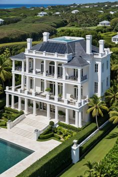 an aerial view of a large white house