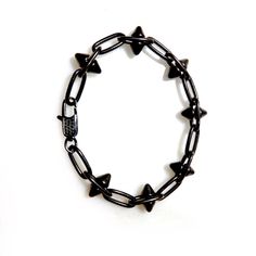 Handcrafted mens bracelet with a heavy pewter antiqued black spikes chain. Super cool and fashion forward, wear it with Jeans and a T-shirt or dressed up. Bracelet measures 7.5" Available in any custom size Made with love in Los Angeles Complimentary gift wrapping provided All sales final. Punk Black Bracelets With Spikes, Black Spiked Edgy Bracelets, Edgy Black Spiked Bracelets, Black Gothic Jewelry With Spikes, Black Punk Chain Bracelet As A Gift, Black Punk Jewelry With Spikes, Black Punk Style Chain Bracelet As Gift, Black Punk Style Chain Bracelet For Gift, Black Metal Spiked Jewelry