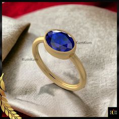 A blue sapphire ring is a beautiful ring with a shiny blue gem. It looks elegant and adds a touch of charm to your finger. The blue color is eye-catching and makes the ring special. People like wearing it for its pretty and classic style. Whether for everyday wear or special occasions, a blue sapphire ring is a timeless accessory that stands out with its unique and stunning blue hue. ➜ Benefits of Blue Sapphire Ring-       ▶ A blue sapphire ring exudes a timeless and elegant charm.       ▶ The v Classic Blue Sapphire Ring With Oval Cabochon, Blue Oval Cabochon Sapphire Ring For Anniversary, Elegant Blue Oval Cabochon Sapphire Ring, Elegant Blue Sapphire Oval Cabochon Ring, Blue Oval Ring With Bezel Setting, Oval Sapphire Ring With Polished Finish As Gift, Blue Oval Birthstone Ring With Bezel Setting, Oval Sapphire Ring, Oval Cut Ring