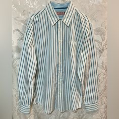 Nwot. Blue & White Striped Button Down Shirt. 2 Button Cuffs. Couple Of Black Smudges By Front Pocket, Like It Was Dropped On Ground In Store. Size L Armpit To Armpit 24” Length 32” Light Blue Casual Collar Top With Button Closure, Light Blue Tops With Casual Collar And Button Closure, Light Blue Tops With Button Closure And Casual Collar, Light Blue Top With Button Closure And Casual Collar, Blue Button-up Shirt With Button Cuffs, Blue Long Sleeve Shirt With Striped Collar, Casual Shirt With Striped Spread Collar, Preppy Blue Button-up Tops, Preppy Blue Shirt With Button Closure