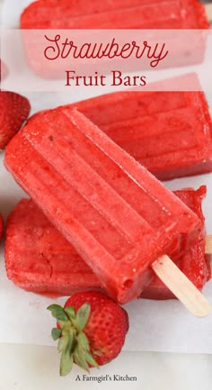 strawberry fruit bars on a stick with strawberries