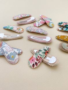 A set of two fabric-covered snap clips by Australian brand, Josie Joan's.The perfect addition to any outfit, these wonderfully whimsical hair clips feature a petite scalloped edge.Josie Joan's beautiful & unique hair accessories encompass a range of heritage prints from Liberty of London and Rifle Paper Co.Dimensions: each clip measures 5.5cm in length (just over 2")Pattern placement may vary. Please avoid getting your snap clips wet. Creative Scrunchie Ideas, Fabric Hair Accessories, Fabric Clips, Whimsical Hair, Ribbon Hair Clip, Beaded Hair Clips, Unique Hair Accessories, Felt Hair Clips, Hair Clips Diy