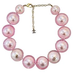 Rare Item - Chanel Ltd Edition 'CC' Logo Pearl Choker Necklace Oversized baby pink faux pearl choker encased in clear resin and detailed with gold 'CC' logo embellishments. Adjustable lobster clasp and a dangle chain with 'CC' logo. From Summer 2017 Collection. Size – One Size Condition – Very Good Composition – Faux Pearls Comes with – Necklace Only Cher Horowitz Jewelry, Star Necklace Gold, Chanel Necklace, Chanel Pearls, Chocker Necklace, Pink Chanel, Pearl Choker Necklace, Pierced Jewelry, Chanel Vintage