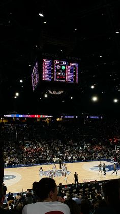 a basketball game is being played in an arena