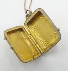 "Vintage gold filled chain and Victorian rectangle photo locket cameo pendant necklace, In good antique vintage condition. The chain 19\" long, Pendant 1\" x 5/8' and ½\" thick. Pendant dates 1890's. Weighs 6.9 gram. Marked 1/20 14k GF on the clasp. Thanks." Antique Engraved Square Pendant Jewelry, Gold Rectangular Keepsake Necklace, Gold Rectangular Pendant Necklace For Keepsake, Gold Rectangular Necklace For Keepsakes, Gold Locket For Vintage Jewelry Collection, Victorian Gold Rectangular Necklace, Victorian Rectangular Gold Necklace, Vintage Gold Locket Necklace With Lobster Clasp, Rectangular Vintage Charm Jewelry For Formal Occasions