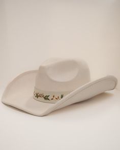 Add a touch of western glam to your outfit with our Cream Floral Embroidered Strap Cowboy Hat! This cute white cowboy hat features a strap embroidered with pretty flower details and pairs well with virtually anything. White Adjustable Felt Hat With Curved Brim, White Adjustable Curved Brim Felt Hat, White Western Felt Hat For Kentucky Derby, White Flat Brim Hat For Ranch, White Western Felt Hat With Curved Brim, Western White Felt Hat With Curved Brim, White Western Felt Hat For The Beach, White Wide Brim Felt Hat For Rodeo, White Brimmed Country Hat