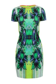 Stand out in the crowd with this funky and fun Elie Tahari dress. Featuring a vibrant green and multi-color print, this short-sleeved dress is perfect for any occasion. Pair it with a neutral pointed-toe pump to complete the look. Get ready to turn heads! Size 4 Shell 97% Cotton, 3% Elastane Neck trim 93% Silk, 7% Elastane Sides 95% Silk, 5% Spandex Lining 100% Polyester Exposed back zipper Short sleeves Blemishes side panels Bust 32" Waist 28" Shoulder to hem 37.5" Sleeve length 7" Printed Green Knee-length Mini Dress, Multicolor Tropical Print Dress For Spring, Multicolor Tropical Print Spring Dress, Spring Tropical Print Dress, Spring Multicolor Tropical Print Dress, Multicolor Graphic Print Dress For Spring, Casual Multicolor Tropical Print Dress, Green Printed Mini Dress For Party, Green Fitted Dress With Abstract Print