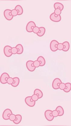 a pink wallpaper with many bows on it