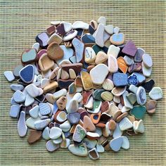 a pile of rocks sitting on top of a woven table cloth next to each other