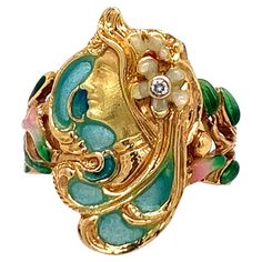 A beautifully crafted art nouveau ring made out of enamel and one round diamond weighing approximately 0.15 carat. The ring features a side profile of a lady. Total weight: 6.9 grams. Size 7.25-7.5. The lady's length is 2.1 cm. French Lady, Art Nouveau Ring, Nouveau Jewelry, Jewelry Board, Jewelry Boards, Art Nouveau Jewelry, French Women, Side Profile, Round Diamond