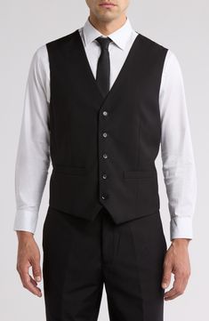 Bring understated elegance to the table in this three-piece suit crafted from rich fabric in a classic single-breasted silhouette. Jacket has notched lapels; chest welt pocket; front flap pockets Vest has front button closure; V-neck Pants have zip fly with button closure; front slant pockets; back button-welt pockets Jacket and vest are lined; trousers are lined to the knee 65% polyester, 35% viscose Dry clean Imported Each suit has a 6” drop, meaning that a size 38R jacket is paired with size Classic Fitted Suit With Hidden Button Closure, Classic Fitted Suits, Classic Fitted Suits With Hidden Button Closure, Classic Three-piece Suit With Notch Lapel For Black Tie, Classic Single Breasted Fitted Tuxedo, Classic Fitted Suit For Black Tie Events, Classic Suits With Single Button And Flat Front, Classic Fitted Suits For Semi-formal Occasions, Classic Fitted Single Breasted Tuxedo