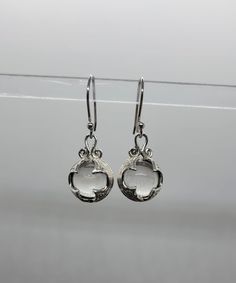 Crystal ball: 10mm Earrings: 30mm length and 11mm width  🌟 All our Silver Jewelry are handmade or handcrafted and guaranteed 925 silver.  ⭐️Free silver polishing cloth  ⭐️ It's completely natural for sterling silver to oxidize over time when it's exposed to air. Please, keep them in airtight plastic bag and use sterling silver polishing cloth to make them shine like new again. ⭐️ Each piece is packed in its own drawstring pouch and ordered is mailed out in bubble mailers to avoid any damages that can happen during transportation. Silver Minimalist Crystal Earrings For Pierced Ears, Minimalist Silver Crystal Earrings For Pierced Ears, Hypoallergenic Round White Gold Earrings, Hypoallergenic White Gold Round Earrings, Sterling Silver Pierced Round Pendant Jewelry, Nickel-free Clear Round Crystal Earrings, Classic Silver Jewelry With Lever Back Ear Wires, Nickel-free White Gold Drop Earrings, Minimalist Sterling Silver Round Crystal Earrings