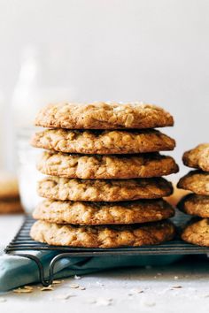 a stack of oatmeal cookies sitting on top of a cooling rack