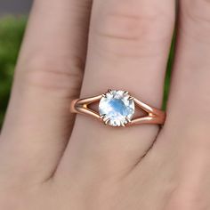 "This is a 1 carat natural moonstone engagement ring in solid gold,about 7mm round cut. It can be made in any ring size. However please contact me to custom make it to a special big or small size. It can be made in white gold,rose gold or yellow gold with 14k or 18k. However for some people who are nickel allergic,I can also make it to 925 sterling silver to make you can wear it. The ring is handmade,very high quality! 30 days money back guarantee. Returns & Warranty 30-Day money back guaran Delicate Moonstone Ring With Rose Cut Diamonds, Promise Moonstone Ring With Rose Cut Diamonds, Moonstone Solitaire Promise Ring, Rose Gold Moonstone Ring With Rose Cut Diamonds, Delicate Round Moonstone Promise Ring, Dainty Moonstone Promise Ring With Round Cut, 14k Gold Solitaire Moonstone Ring, Wedding Moonstone Ring Solitaire In Round Cut, Wedding Solitaire Moonstone Ring, Round Cut