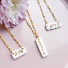 Personalised white clay necklace with gold letters on a gold plated chain.Such a necklace would make great gift for any occasion.To place an order just select type of necklace and leave note in customisation box or message me word/name you would like me to make.You can also leave message in personalisation section with preferable length of the necklace (please see last picture for guide). If there no message I will make necklace 18inch long.If you would like to have few  pendants just message me Handmade White Charm Necklaces For Birthday Gift, Custom Name White Charm Necklace For Birthday, White Custom Name Charm Necklace For Birthday, Customizable White Necklace For Birthday, White Custom Name Charm Necklaces For Birthday, Customizable White Nameplate Necklace, Handmade White Charm Necklace For Mother's Day, Handmade White Charm Necklaces For Mother's Day, Handmade White Name Necklace For Mother's Day