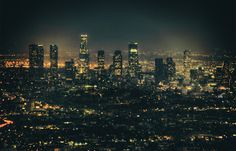 an aerial view of the city lights at night